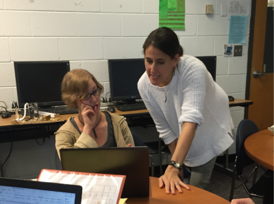 Professor Jennifer Koster assists student Abbigail Traaseth. Photography by Cynthia Beasley