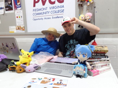 students posing at Anime Table during Club Day