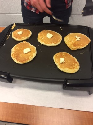 Pancakes at the Lumberjack Club meeting. Photography by Skye Scott 