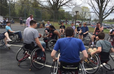 Cardinal player Rush explaining basic rules of wheelchair basketball to PVCC students.  Photograph Courtesy of Susan Hannifan  