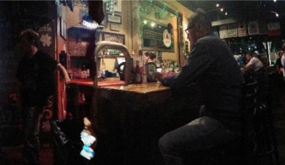 Teams playing trivia at Pub Quiz Night at the Tin Whistle Irish Pub in Charlottesville. Photography by Michaela Courtney. 