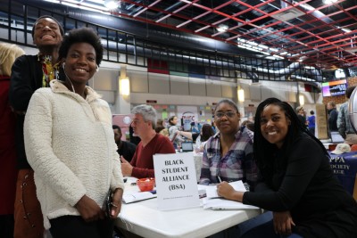 Students pose at BSA table during club day