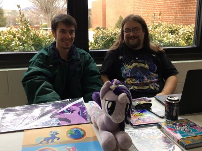 two students pose with my little pony paraphernalia 