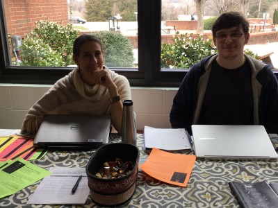 Professor Kostner and student pose at club day table