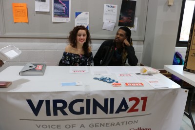 Gigi Gett poses with another student at the VA21 table