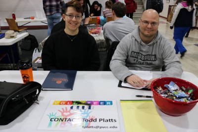 Todd Platts poses with a student at the club day table