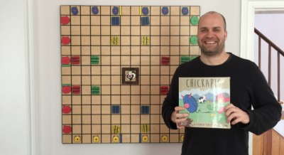 Brian Calhoun poses with the game he invented. Photography by John Matthews 