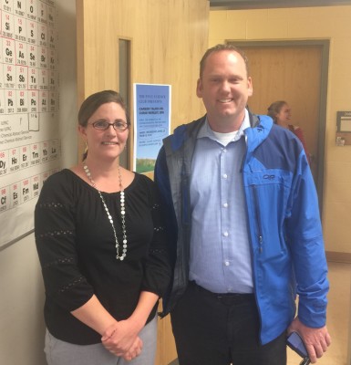 Anne Allison and Chris Worley stand in a science classroom. 