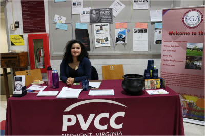 SGA president Sophia Keniston recruiting new members at the SGA table.