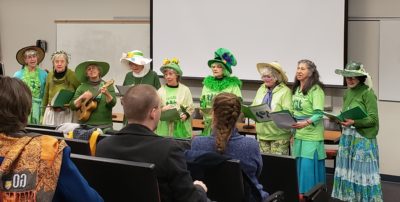 The Green Grannies Group singing one of their songs in between speakers.