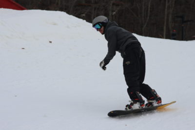 Snow Boarder coming down the hillside at Massanutten