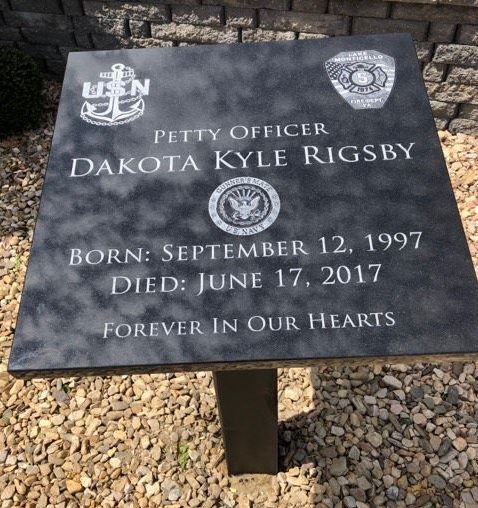 Plaque outside post office commemorating Dakota Rigsby's service and death.
