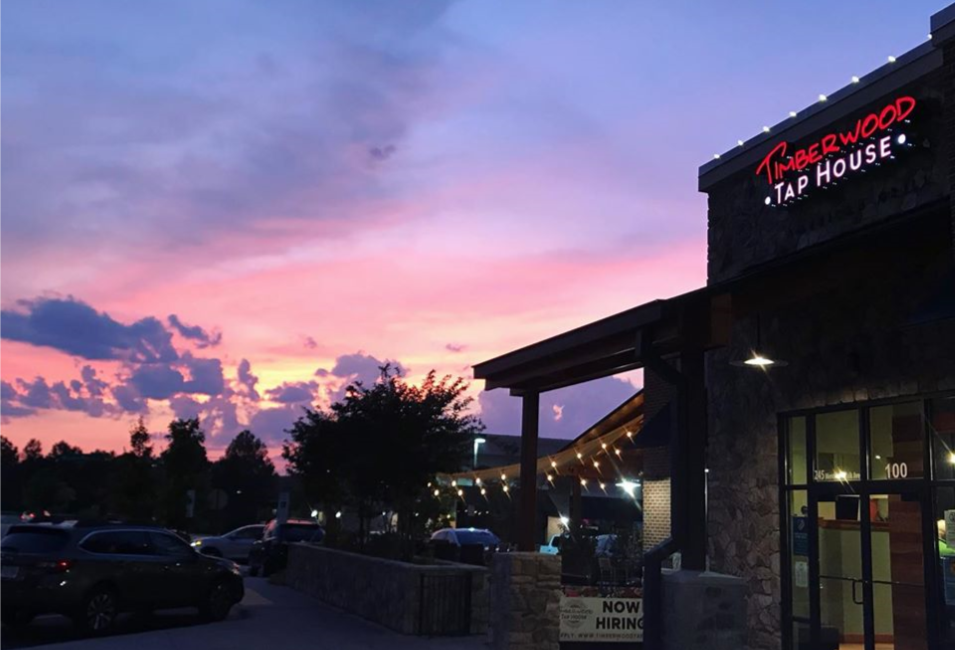 Timberwood Tap House against a sunset.