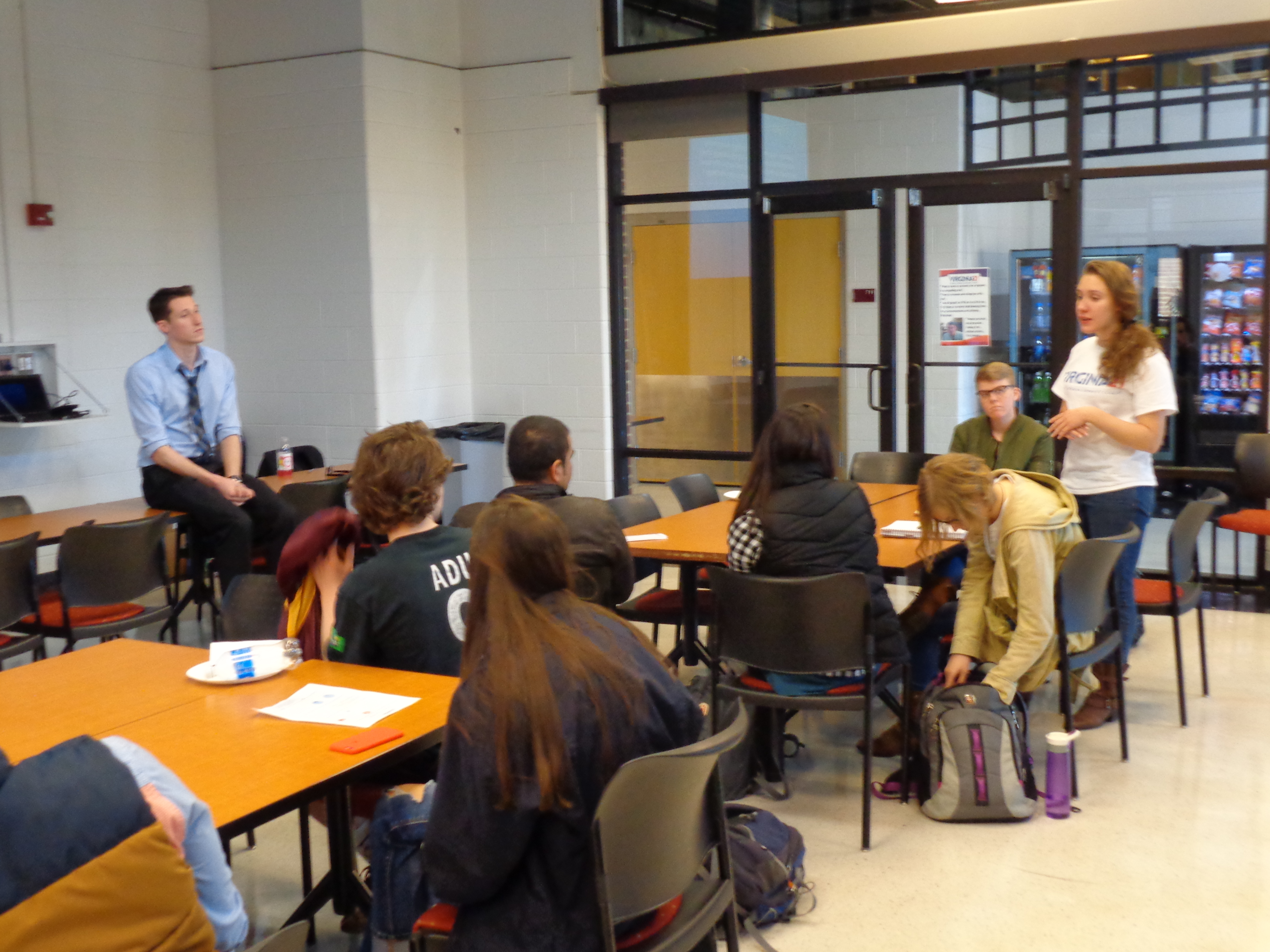 The meeting participants energetically discussing politics. Photo by Charles Stish