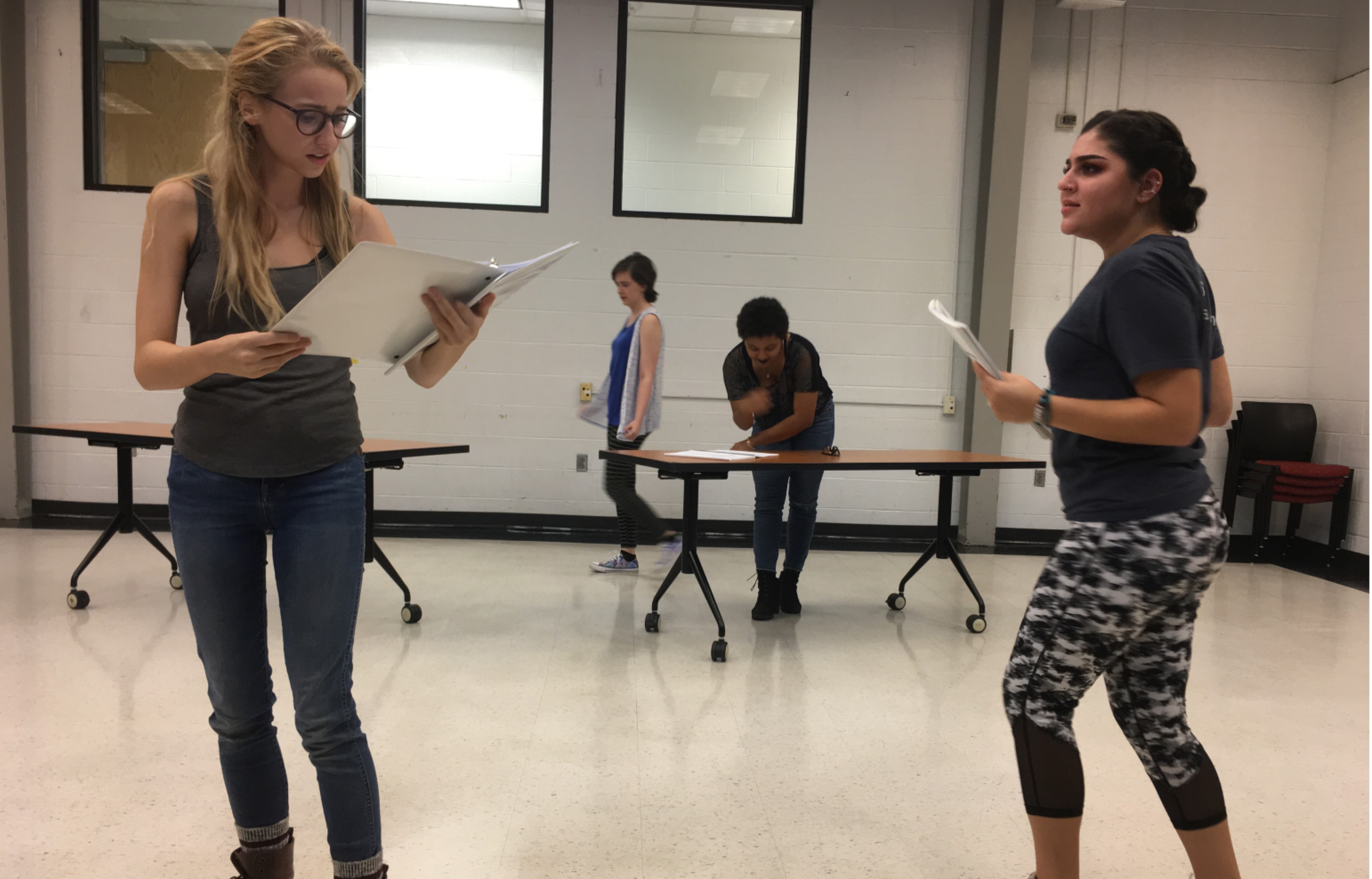 Madison Weikle and Ana Lorenza rehearse a scene in the North Mall Meeting room.