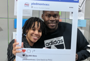 A PVCC student and staff member posing for a candid photo on Giving Tuesday