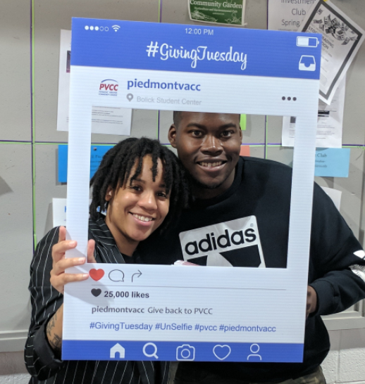 A PVCC student and staff member posing for a candid photo on Giving Tuesday