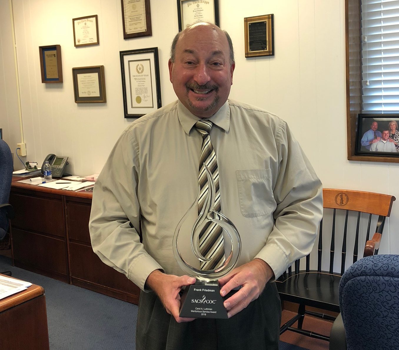 PVCC President showing off his award that he received for his years of service.