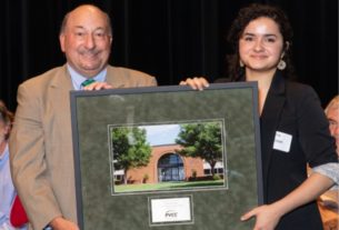 Dr. Frank Friedman awarding Sophia Keniston