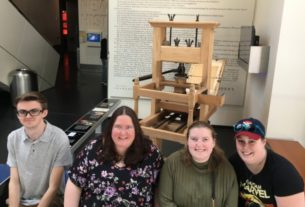 The Forum Club members sitting in front of the Gutenberg Press