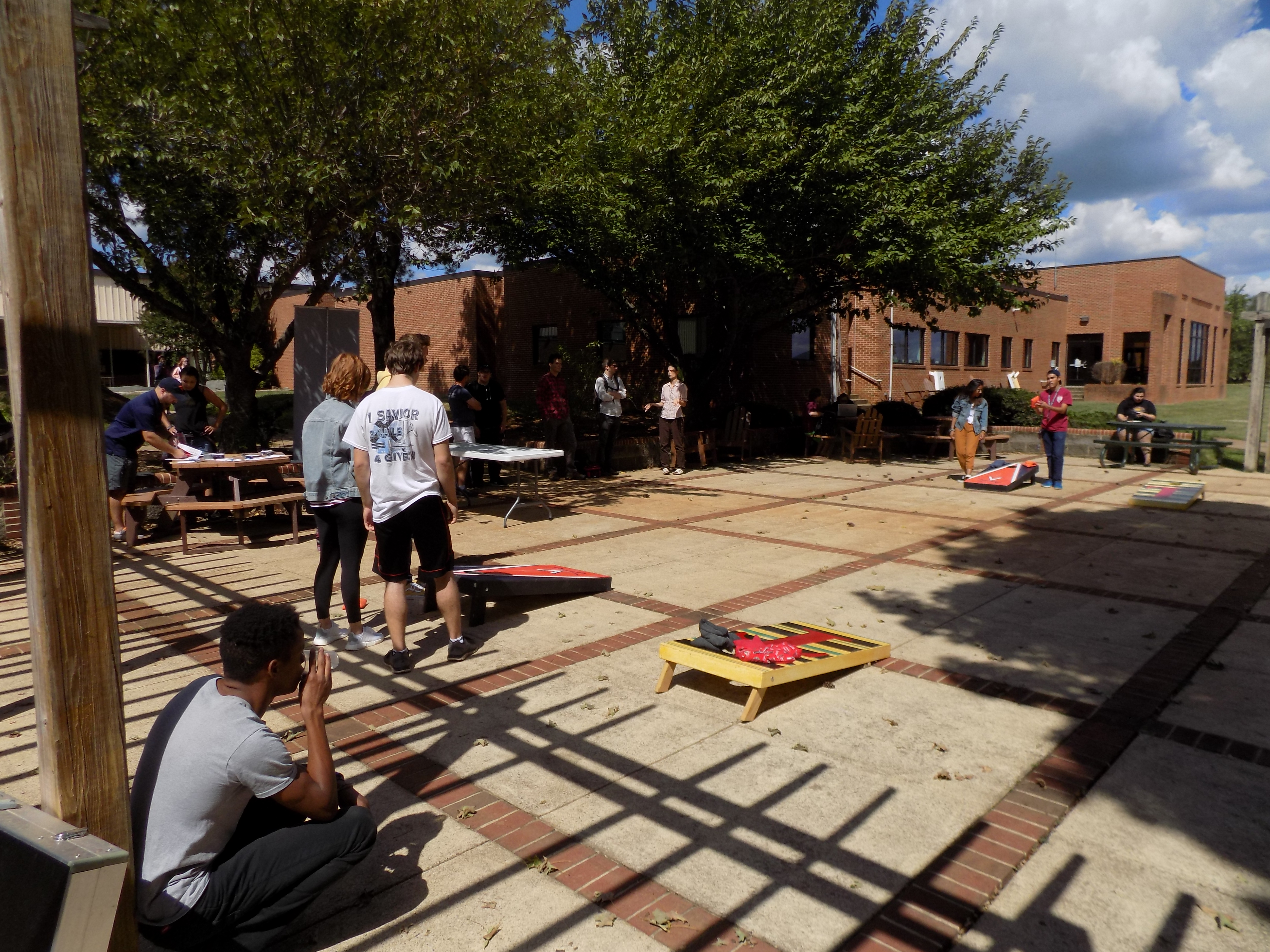 Cru Club members play corn hole.