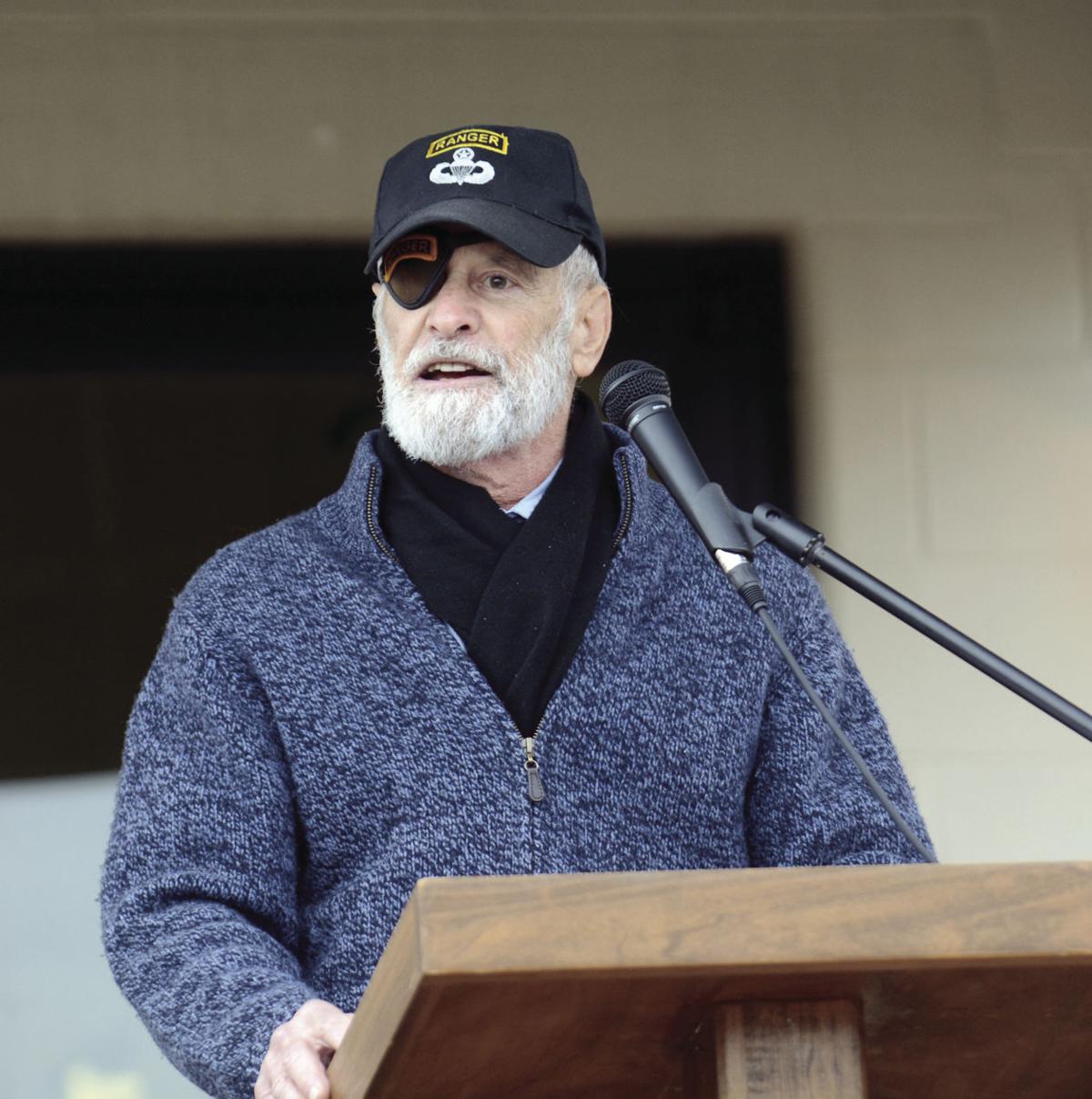 Col. Hughes at the podium