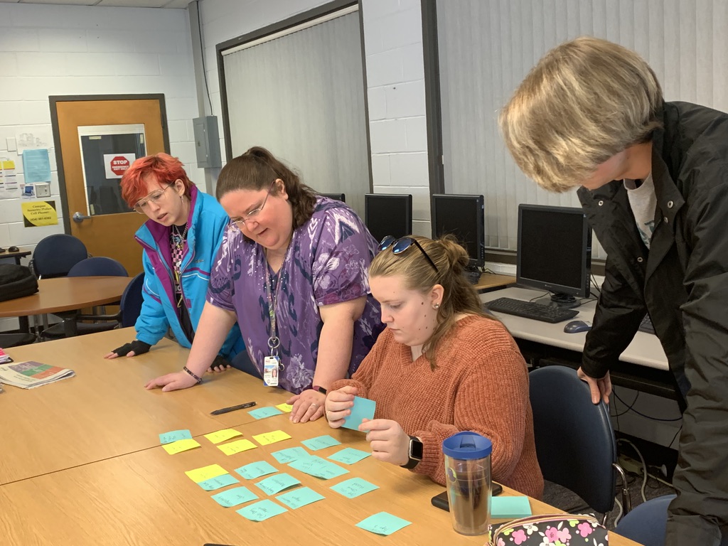 Ginger Hood, Dr. Whyte, Jessica Adkins, Cody Clark plan the layout for The Forum