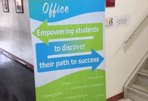 A sign directing students towards the student success office
