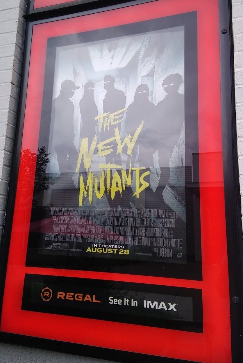 the movie poster for The New Mutants outside a movie theater