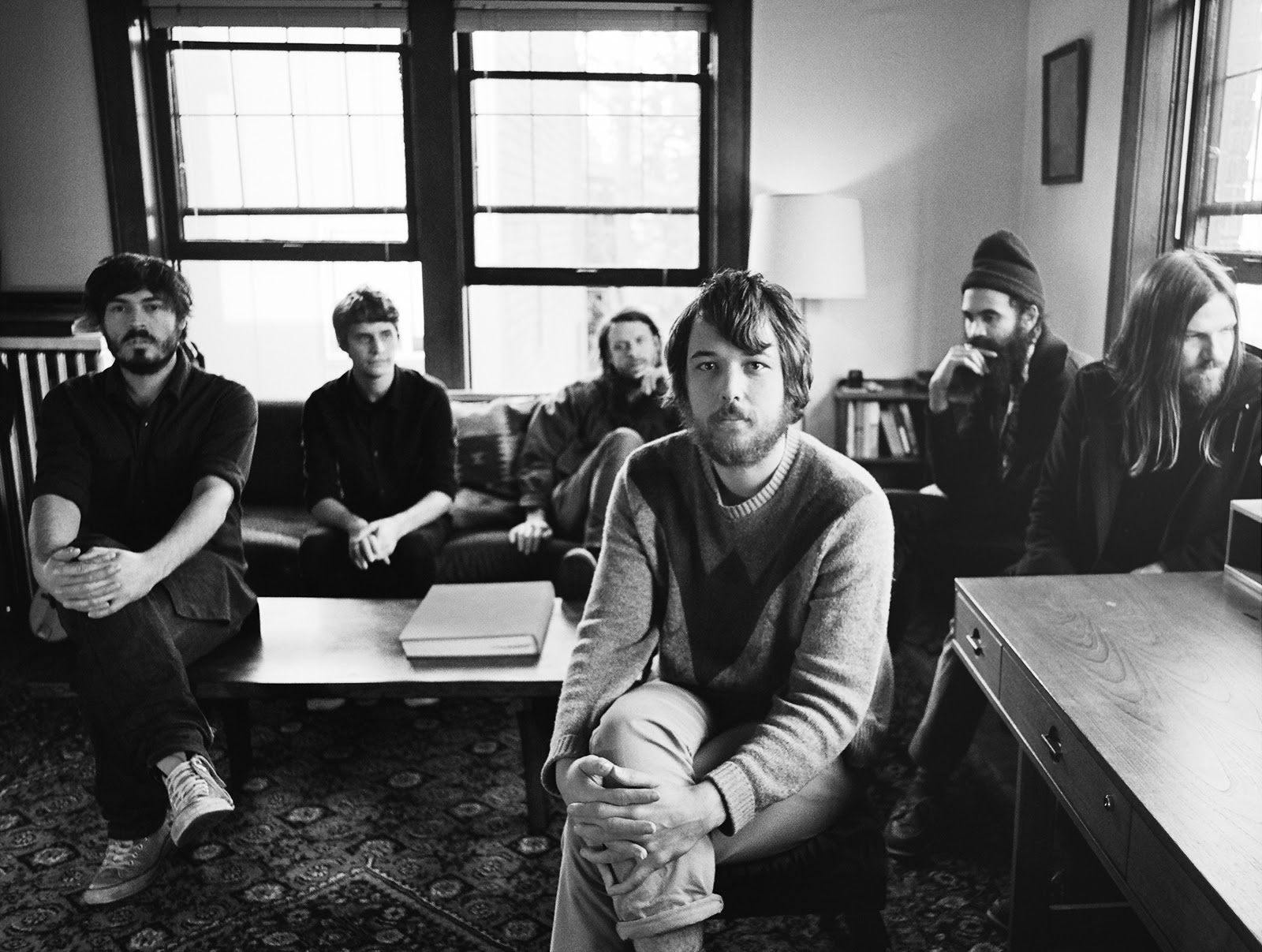a black and white picture of the band Fleet Foxes.