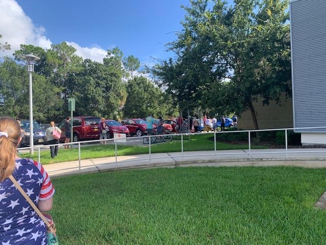 Beginning of the voting line in Florida while voting early. Photography by Evan Green.