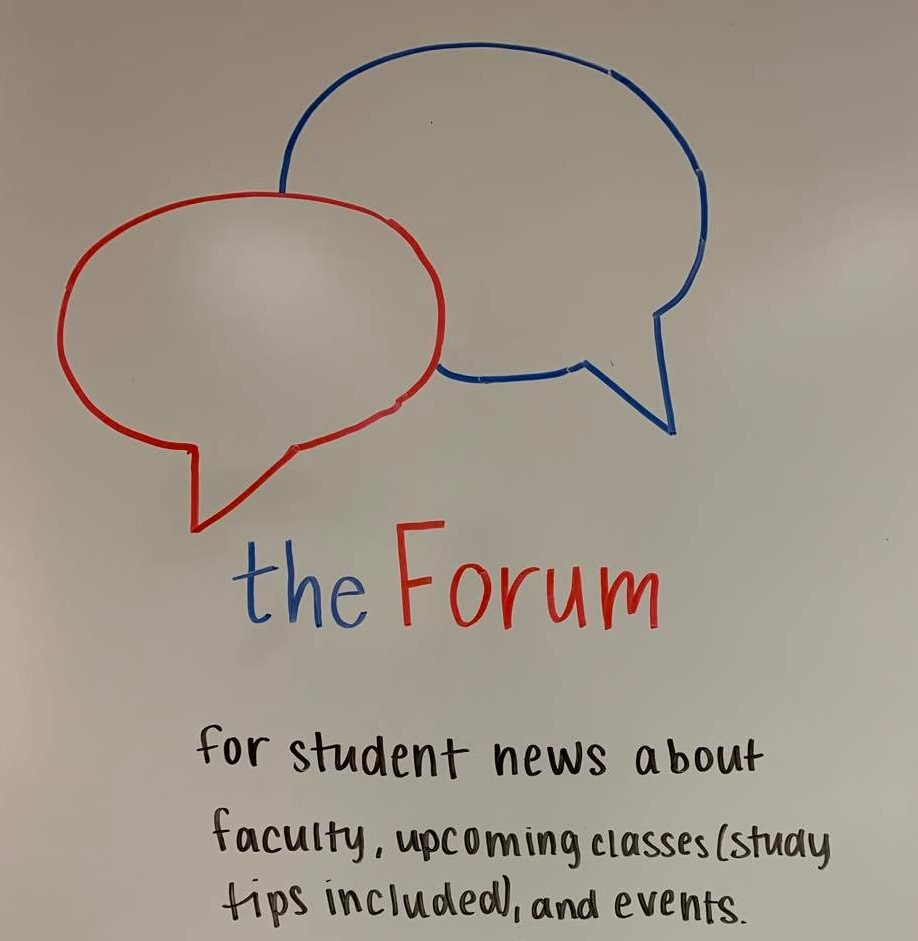 A drawing on a whiteboard advertising The Forum.