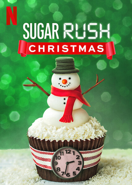 A snowman sits atop a cupcake with a clock inside it as the Sugar Rush Christmas logo looms overhead