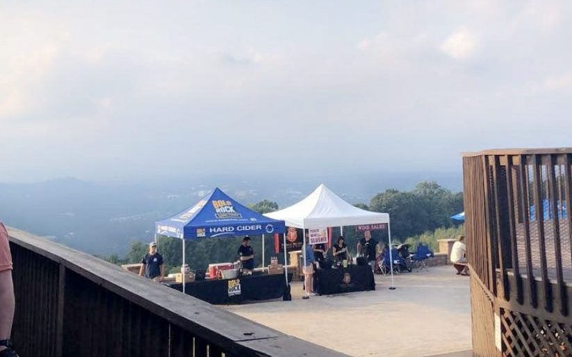 View from the main Carter Mountain store showing beverage tents and mountains in the distance.