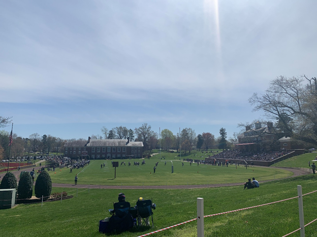 Hampden Sydney vs Ferrum football game on a green with scattered fans in attendance