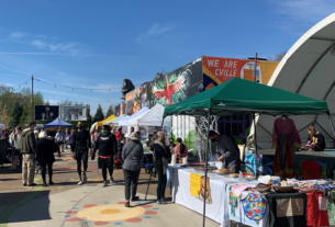 Locals shop at the colorfully designed IX Art Park Farmers Market