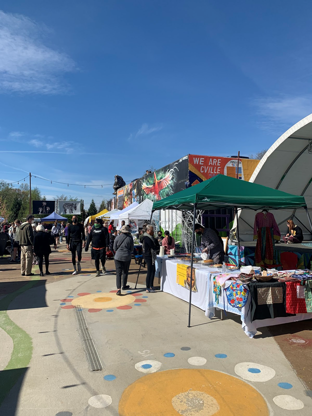 Locals shop at the colorfully designed IX Art Park Farmers Market