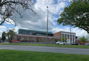 Historic Monticello Dairy building turned market on a partly cloudy day