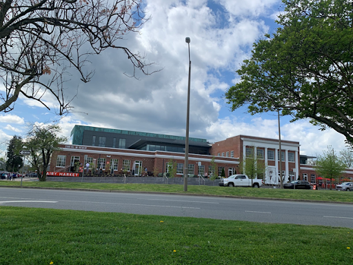 Historic Monticello Dairy building turned market on a partly cloudy day