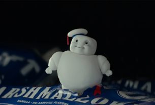 A delightfully rotund little marshmellow man, the stay-puft marshmellow man, looks ponderously up at the camera