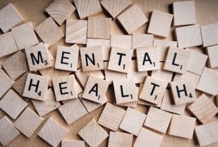 Mental health spelled out with scrabble tiles