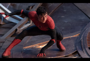 Spider-Man in his black and red suit inin a heroic pose.