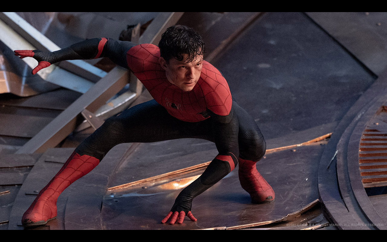 Spider-Man in his black and red suit inin a heroic pose.