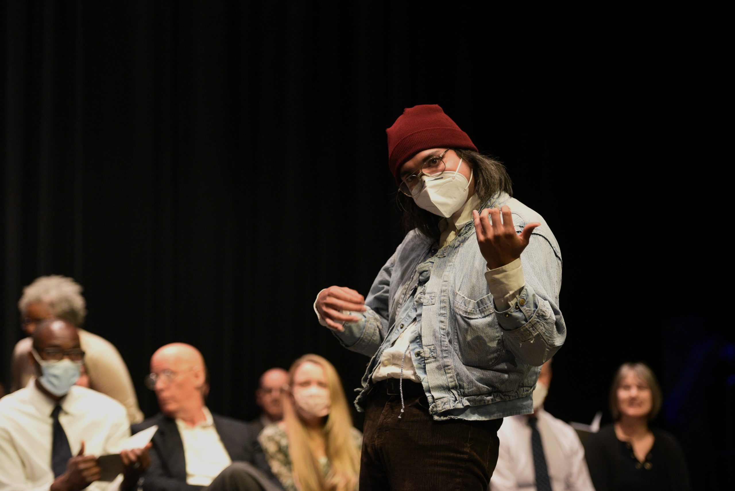 Carlos-Banda-Montes plays air-guitar while receiving the Music Club award