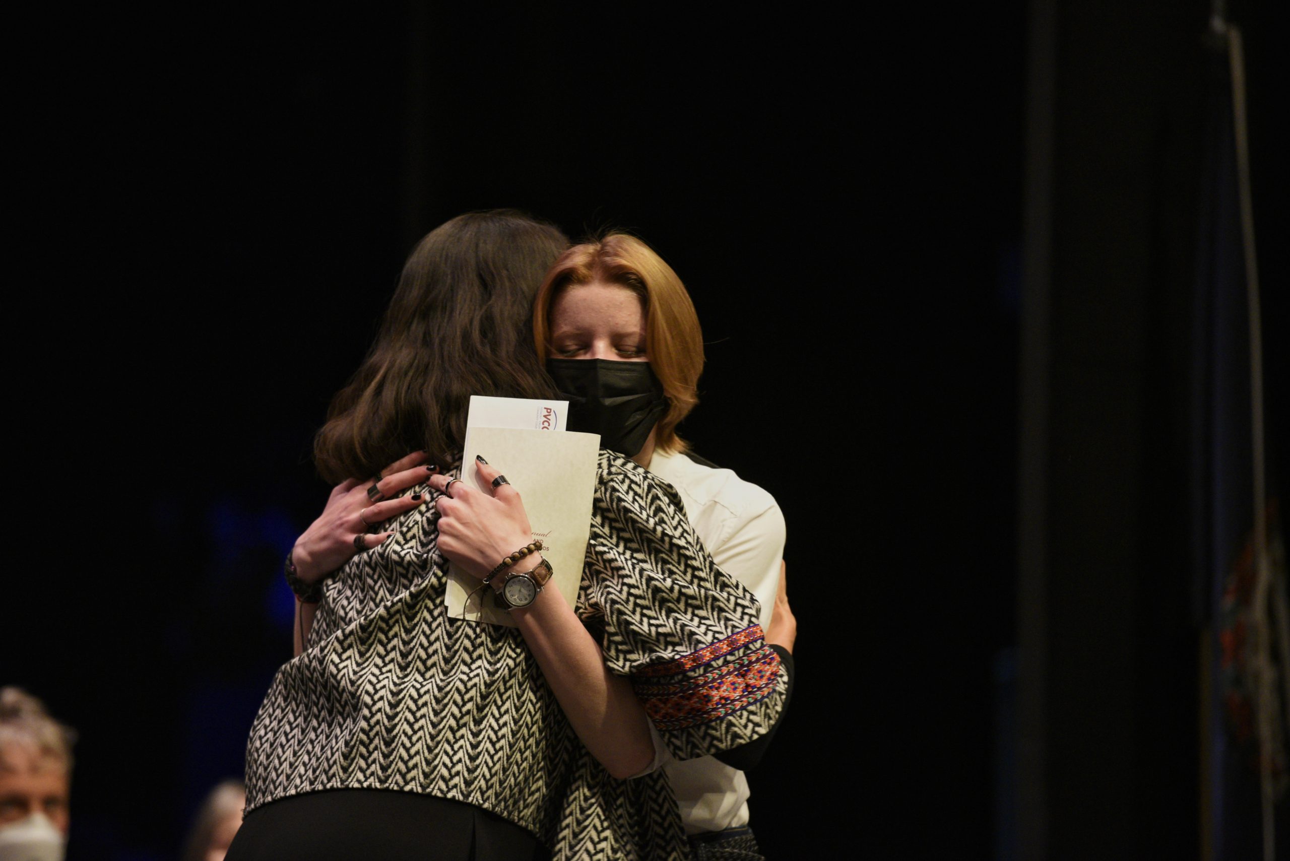 Professor Jennifer Koster hugs Caroline Kenney