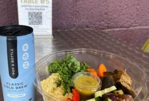 A drink and Mezze Tabbouleh Bowl sitting on a table