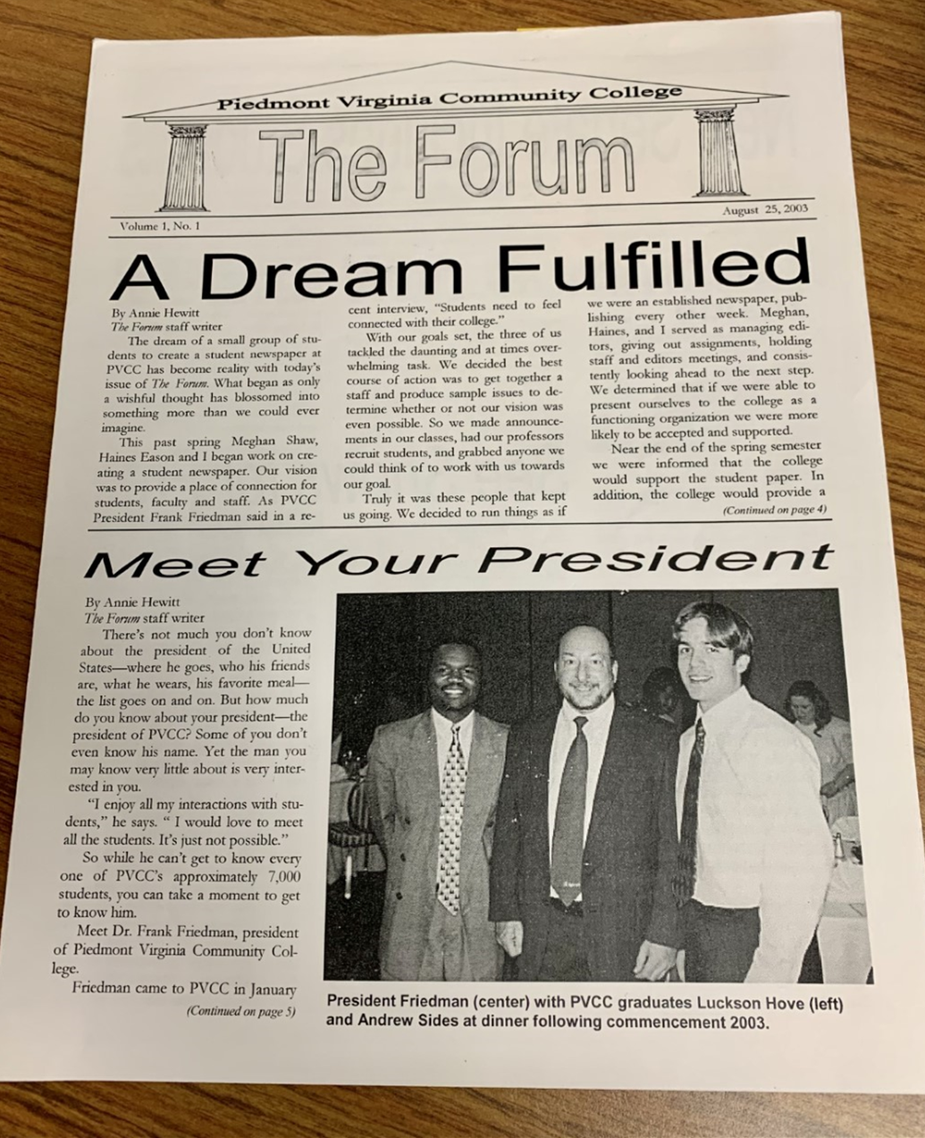 The front page of the school newspaper. It says "The Forum" at the top, with two articles below and a picture of three men.