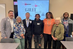 Smithbey, Shawn Sanders, Beverly Baber, Malcom James, and others all smile for the camera after the GRIT event.