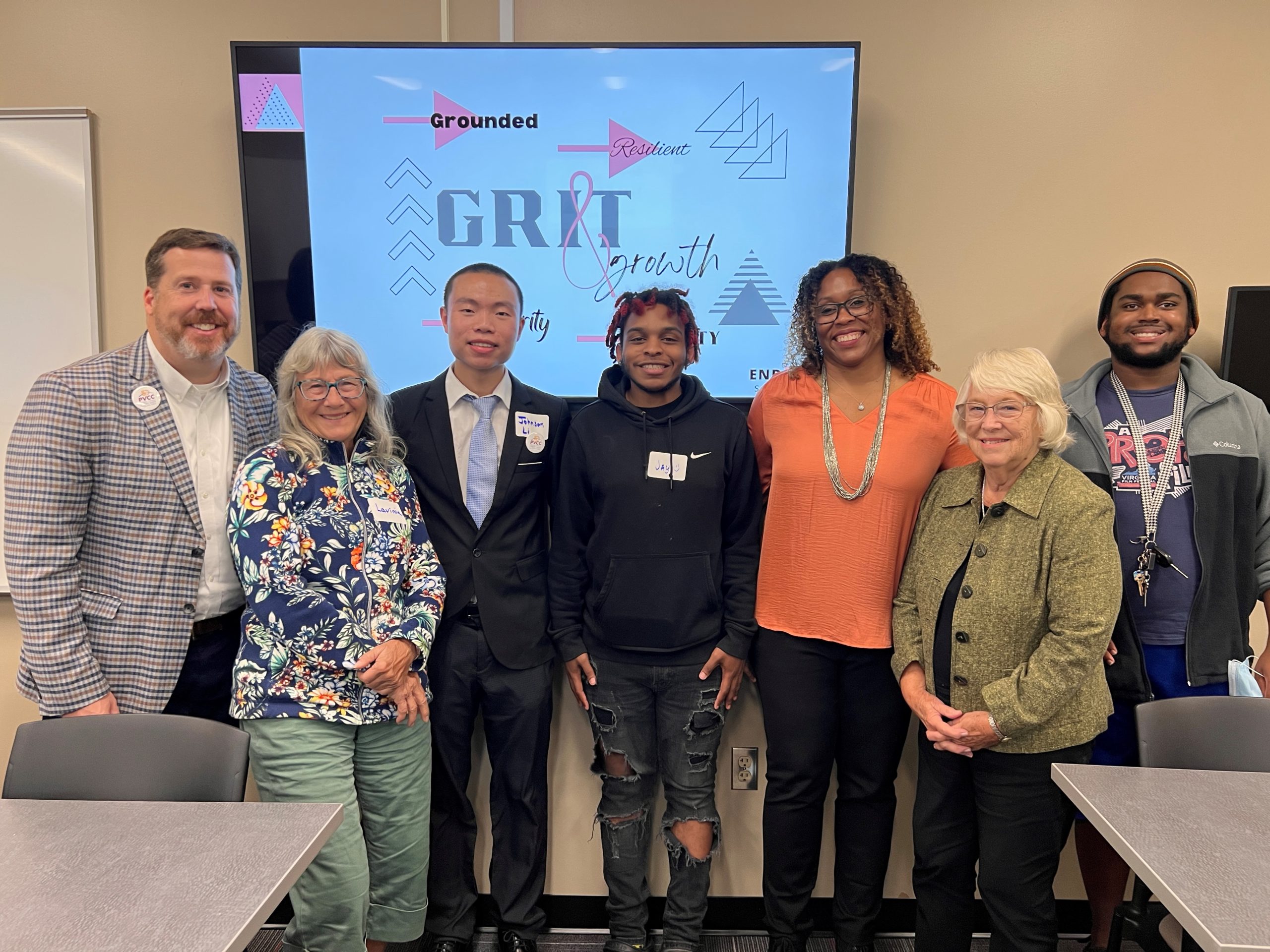 Smithbey, Shawn Sanders, Beverly Baber, Malcom James, and others all smile for the camera after the GRIT event.