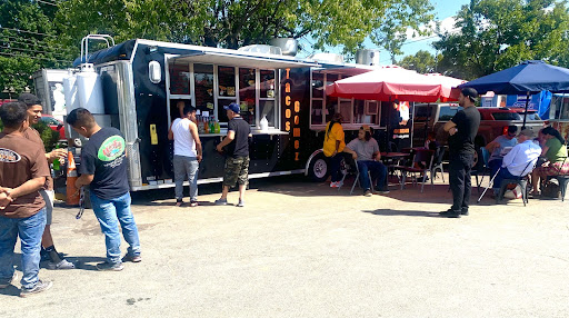 Taco Gomez food truck serving customers.